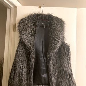 Sleeveless black  gray jacket,two snaps closing, worn 2 times, good condition